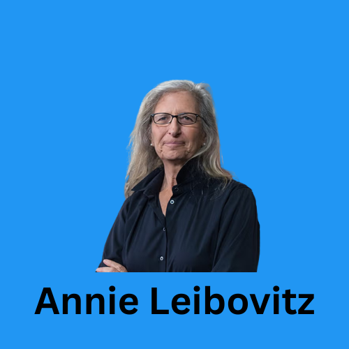 Image shows a headshot of Annie Leibovitz on a blue background.