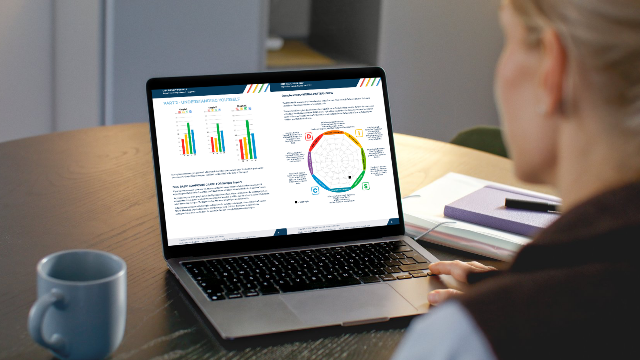 image shows a woman sitting at a table looking at a disc profile on her computer.